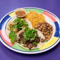 2 Tacos · Rice and beans.
