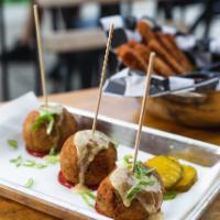 Cheeseburger Lollipops · Breaded Risotto Balls Stuffed With Ground Beef, Bacon, Mixed Cheese, & Scallions. With Srira...