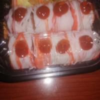 Spicy Girl Roll · Tuna salmon cucumber jalapeno inside crabmeat on top w chili spicy mayo sauce 