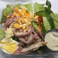 Chef Salad · Ham and smoked turkey with American and cheddar cheeses served with a hard boiled egg on a b...