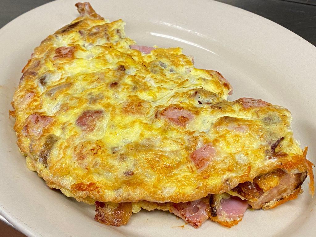 Meat Lover Omelette · Ham, bacon, and sausage omelette served with home-fries and a toast
