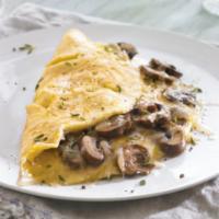 Swiss and Mushroom Omelette · omellete with mushrooms and swiss  served with home fries and a toast