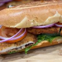 Breaded Chicken Cutlet Sandwich · chicken Breaded with cheese, lettuce, and tomato.