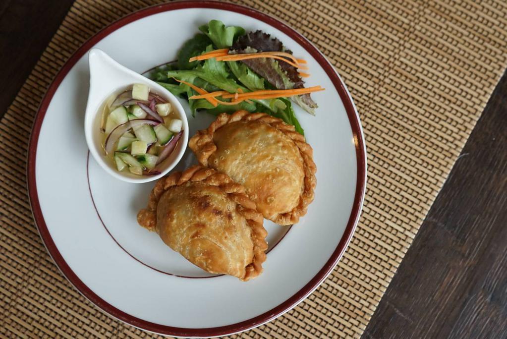 Chicken Curry Puffs · Served with sweet cucumber relish.