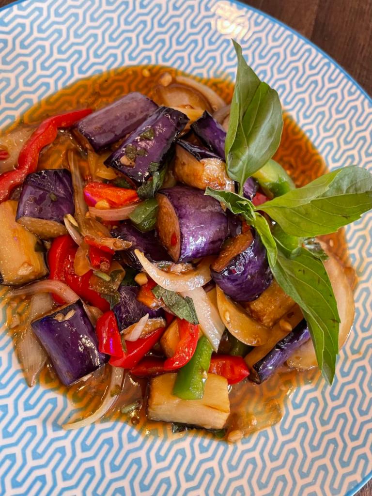 Eggplant Basil 🌱🌶️ · Eggplant, chili, garlic, onion, bell peppers, basil & homemade sauce. Served with rice. 