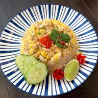 Crab Fried Rice  · garlic, eggs, tomatoes, onion, scallions and crabmeat. 