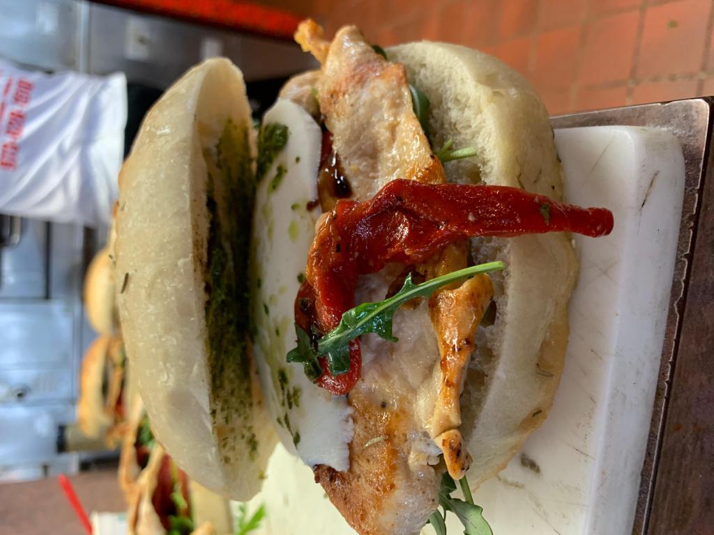 Homemade Panini · Grilled chicken, fresh mozzarella, roasted peppers, arugula with balsamic dressing and pesto sauce.
