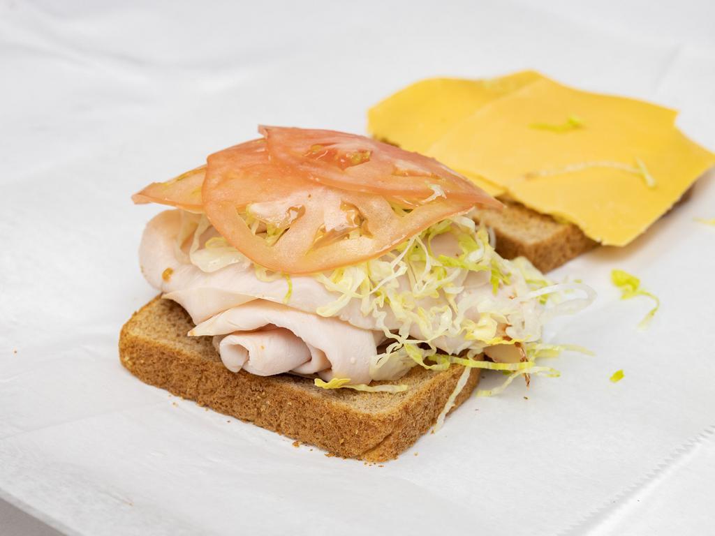 Turkey and Cheese Sandwich · Honestly Turkey with classic American cheese on bread of your choice.