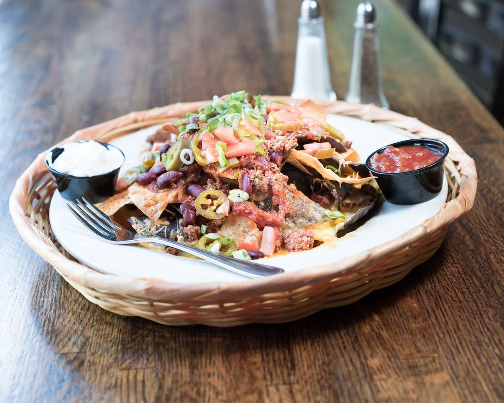 All American Nachos · Home style tortilla chips topped with chili, jalapenos and
cheddar jack cheese. Served with sour cream and salsa.