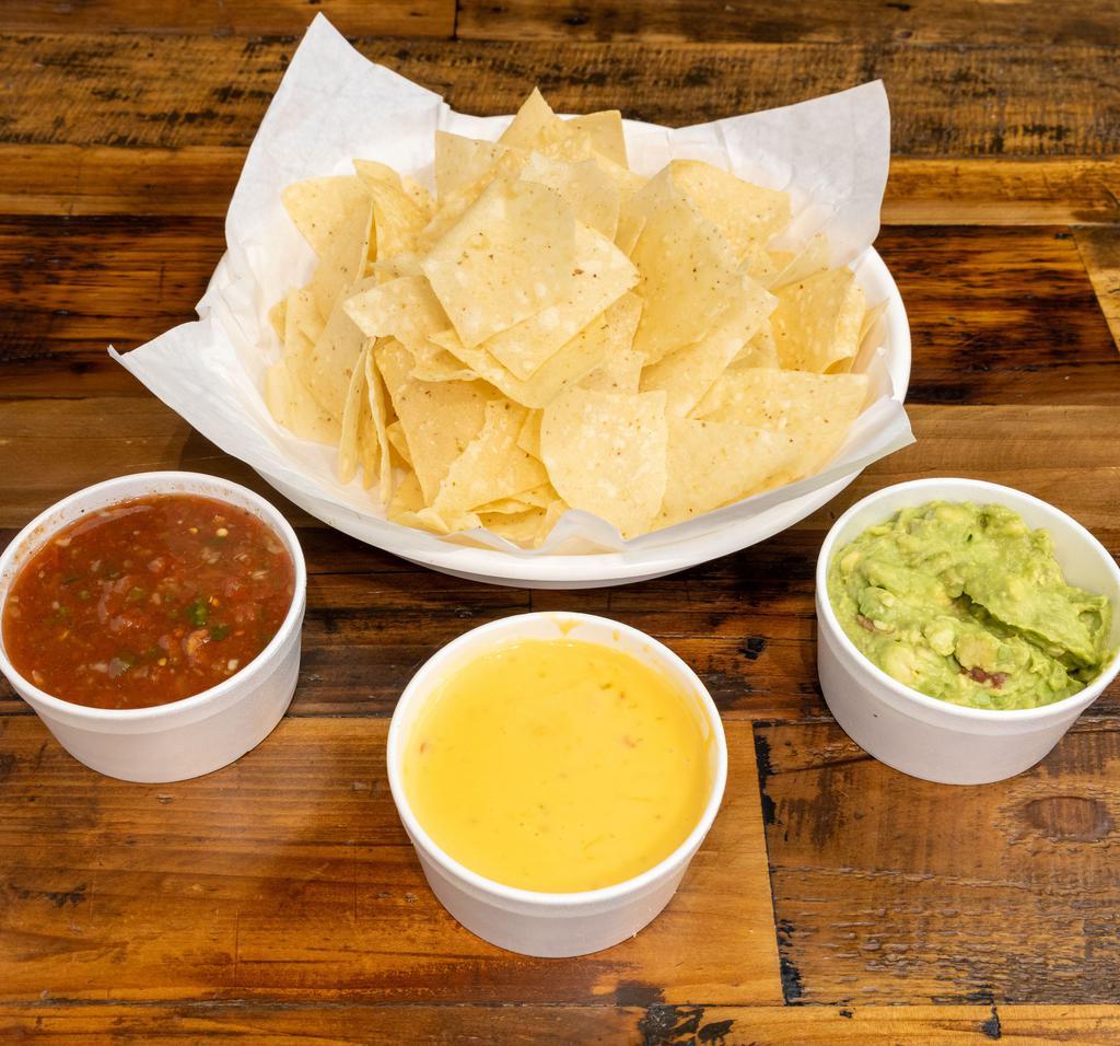 Tres Amigos · House made chips with queso, salsa, and guacamole.