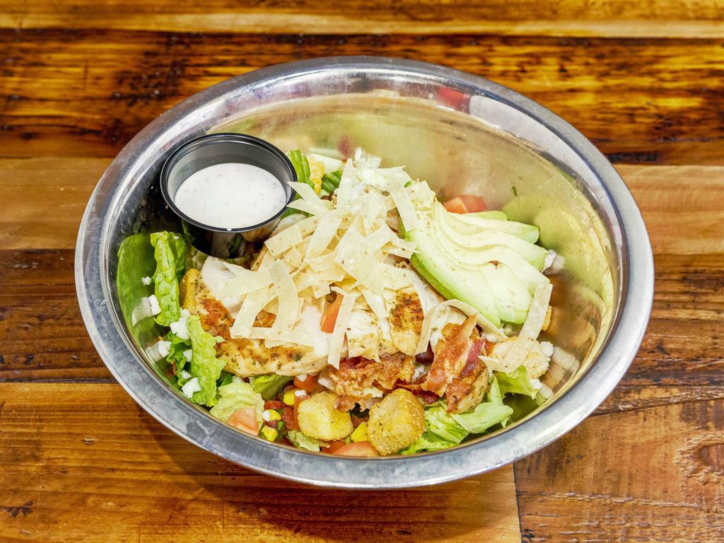 Grilled Chicken Salad · Bacon, avocado, corn salsa, shredded cheese, diced tomatoes, and tortillas chips. Choice of classic ranch or jalapeno ranch dressing. 
