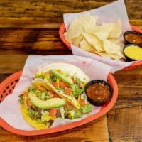 Montero Tacos · Thinly sliced beef, cheddar cheese, lettuce, tomato, and avocado topped with salsa.  Served ...