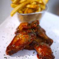 Kids 4 Piece Chicken Wings and Fries  · Honey BBQ, lemon pepper or Buffalo served with our seasoned fries. 
