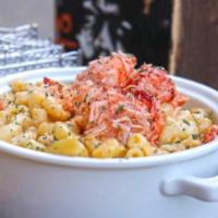 Lobster Mac and Cheese · Creamy macaroni and cheese covered in Maine lobster.