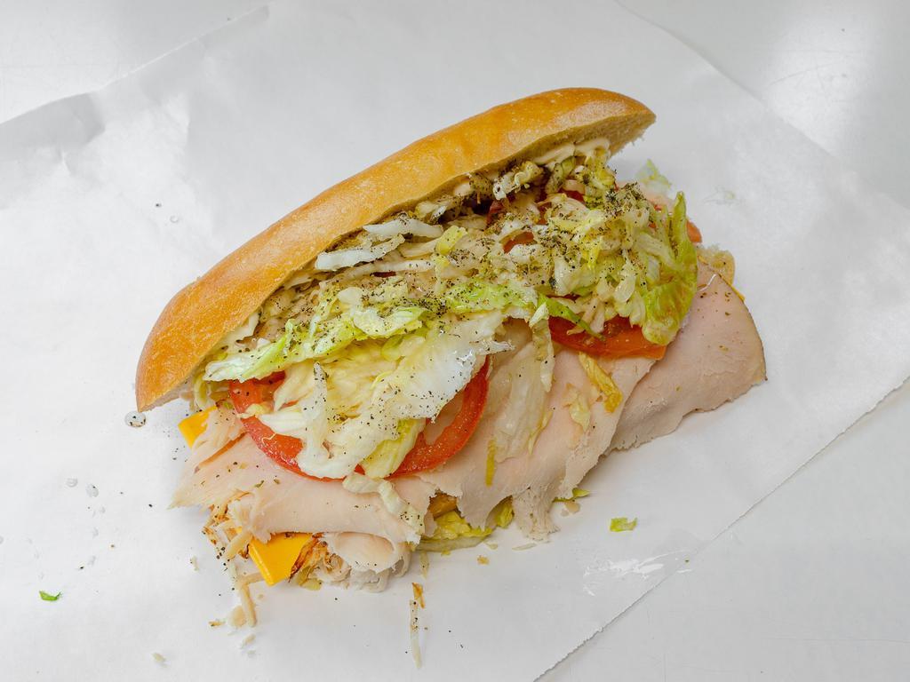 Turkey and Cheese Sandwich · Lettuce, tomato, onion, oil, vinegar, salt, paper, and mayo,