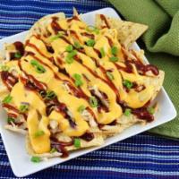 BBQ Chicken Nachos · Tortilla Chips topped with our Smoked BBQ Chicken, Our Award Winning Chicken Rub and Origina...