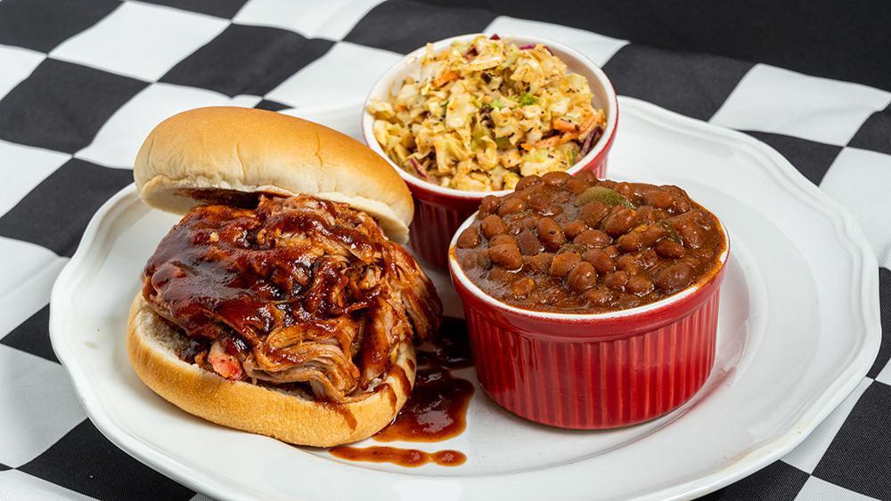 183. The Powerful V8 · Feeds 8! 2.5 lbs. of Victory Lane BBQ’s Slow Smoked Pulled Pork, Seasoned with our Award-Winning Competition Rub!  Served with 8 Buns, a choice of our Award-Winning BBQ Sauce, Pint of Cole Slaw and your choice of 2 additional Quarts of our Signature Sides.