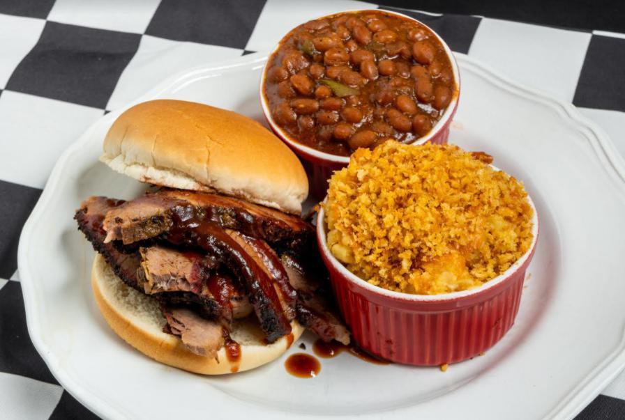 63. Beef Brisket Sandwich Combo · Slow smoked with Victory Lane BBQ’s Award-Winning Beef & Brisket Rub that melts in your mouth! Comes with our delicious Cole Slaw and Award-Winning BBQ Sauce.  PLUS one of our Signature Sides.