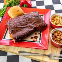 102. 1/2 Slab Rib Plate · Half Slab of Baby Back Ribss with 2 of our Signature Sides and a choice of our Award-Winning...