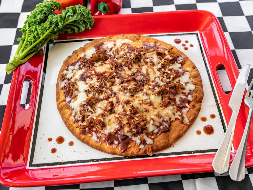 121. BBQ Pork Pizza · 12“ BBQ Pork Pizza with either VLBBQ’s Award-Winning Original or Spicy BBQ Sauce, a Layer of delicious Mozzarella, and Topped with our Award-Winning Competition Rib Rubbed Pulled Pork!
