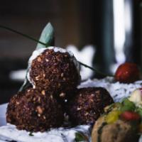Falafel Over Rice bowl(vegan) · Served with Falafel, Rice, Lettuce, and Tomatoes along with your Favorite Toppings and White...
