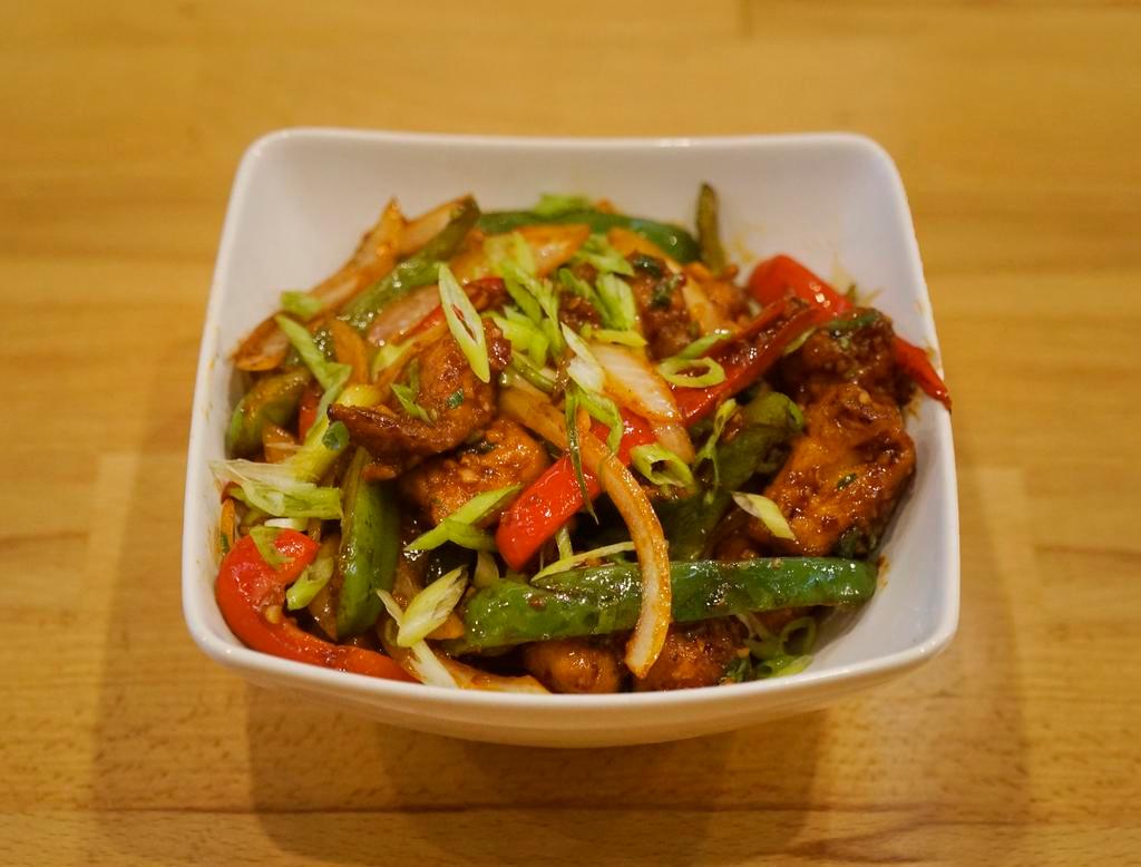 Sauteed Chilli Chicken · Dry. Tender pieces of chicken prepared with fresh herbs and chili peppers. Gluten free.