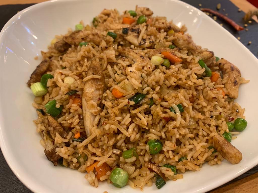 Chicken Fried Rice · Basmati rice stir-fried and seasoned to perfection with shredded piece of tender chicken. Gluten free.