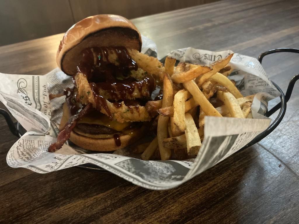 BBQ Bacon Burger · 7 0z brisket patty topped with cheddar cheese, bacon, onion rings and bbq sauce. 