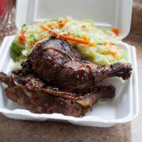 Jerk Chicken · Includes rice and your choice of side. 