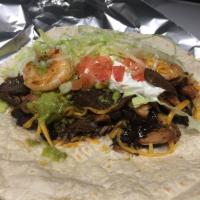 61. Chicken, Steak and Shrimp Burrito · Served in large fresh tortillas with rice, black beans, salsa ranchero, cheddar cheese, guac...