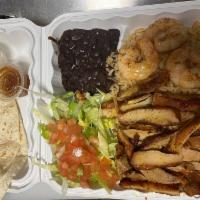 S13. Chicken and Shrimp Special · Served with 2 pieces fresh tortillas Mexican rice, beans, sour cream, salsa ranchera, lettuc...