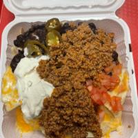 97. Tex Mex Chili Nachos · Ground beef. Homemade yellow corn tortilla chips, covered with melted cheese, jalapenos, bla...