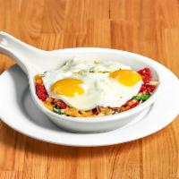 Veggie Skillet · Roasted marinated tomatoes, mushrooms, onions, spinach, Monterey jack, and cheddar cheese. T...
