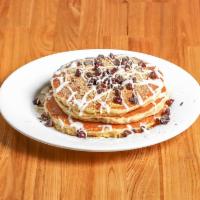 S'mores Pancakes · Homemade pancakes topped with chocolate chips, graham cracker crumbs, and a marshmallow driz...