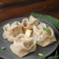 Manti · Steamed Uzbek dumplings filled with steaks, onions, sold and paper. Served with a side of ca...