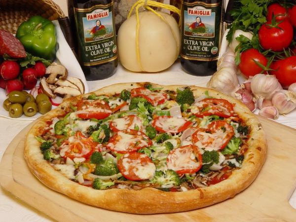 Primavera Pizza · Mushrooms, peppers, onions, spinach, broccoli, tomatoes, and extra cheese. Vegetarian.