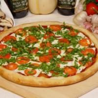 Pizza Fresca · Fresh mozzarella, fresh basil, tomatoes and olive oil.