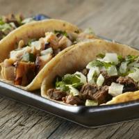 4 Mini Tacos · 4 street tacos with 1 choice of meat, onion, cilantro and guacamole salsa.