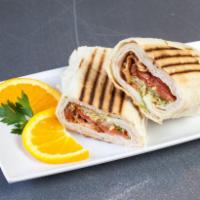 Turkey Club Wrap · Oven gold turkey, bacon, lettuce and tomatoes.