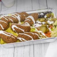 Falafel over Rice · Falafel over rice with some salad and your choice of sauce.
