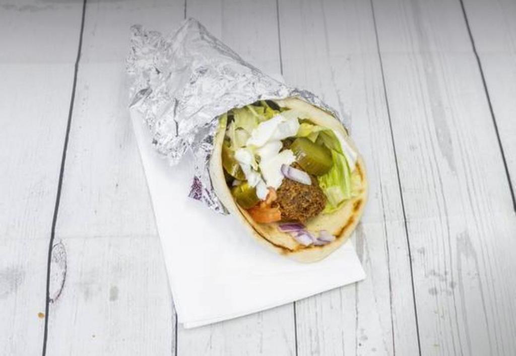 Falafel Sandwich · Falafel and some salad on a pita bread with your choice of sauce.