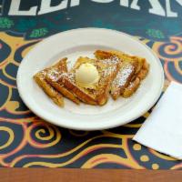 French Toast Breakfast · Thick Texas style bread dipped in a cinnamon-nutmeg egg batter served with butter, maple syr...