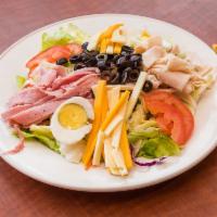 Chef Salad · Fresh greens topped with ham, turkey, 2 cheeses, tomatoes, olives and boiled eggs. Served wi...