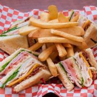Club · Triple decker layered with ham, turkey and bacon, lettuce and tomato with Swiss or cheddar c...