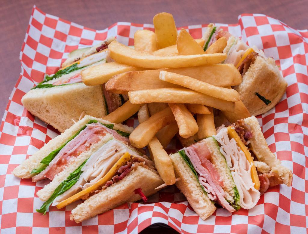 Club · Triple decker layered with ham, turkey and bacon, lettuce and tomato with Swiss or cheddar cheese. Served with your choice of side.