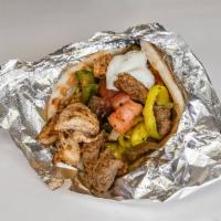 Mix gyro · Chicken n lamb with: onions, tomato, green peppers, lettuce and tzatziki sauce.
