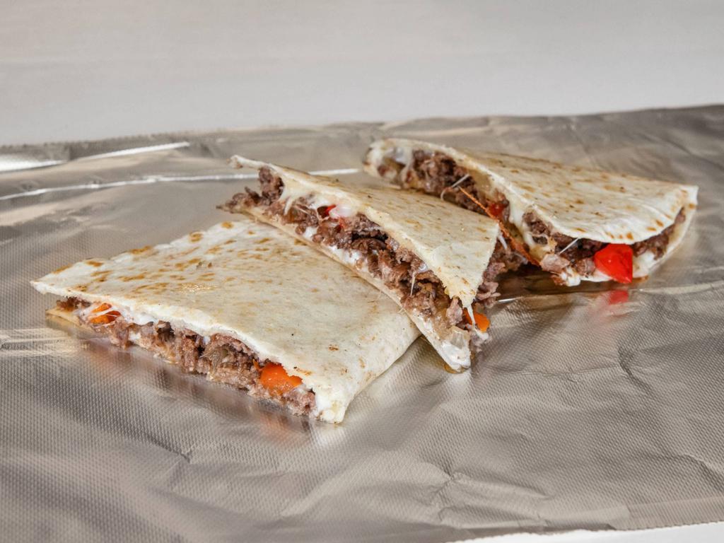 Steak Quesadilla · Topping choices: onion, green peppers, mushrooms, mozzarella cheese and sour cream.