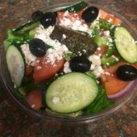 Greek Salad · Romaine lettuce, cucumber, red onions, green peppers, feta cheese, tomatoes, black olives an...