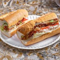 Turkey Club Sandwich · Turkey, lettuce, tomato, bacon and mayo on a hero