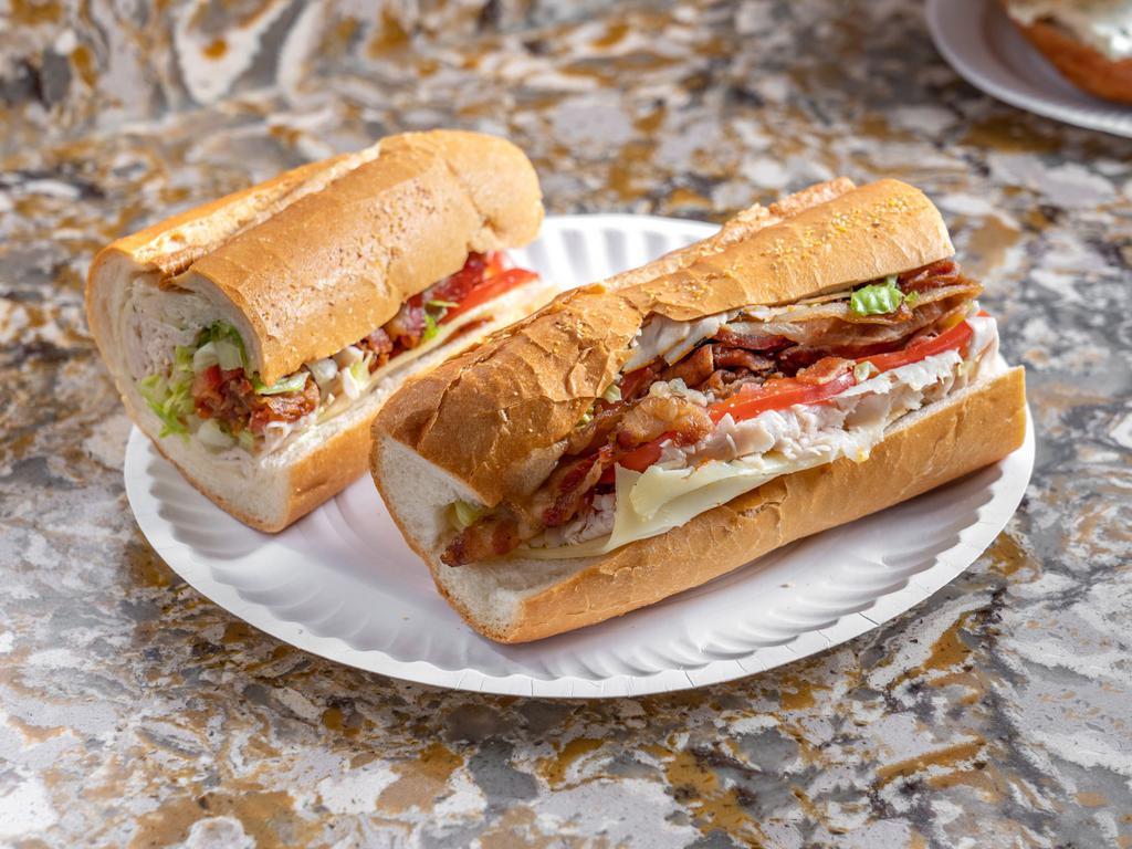 Turkey Club Sandwich · Turkey, lettuce, tomato, bacon and mayo on a hero